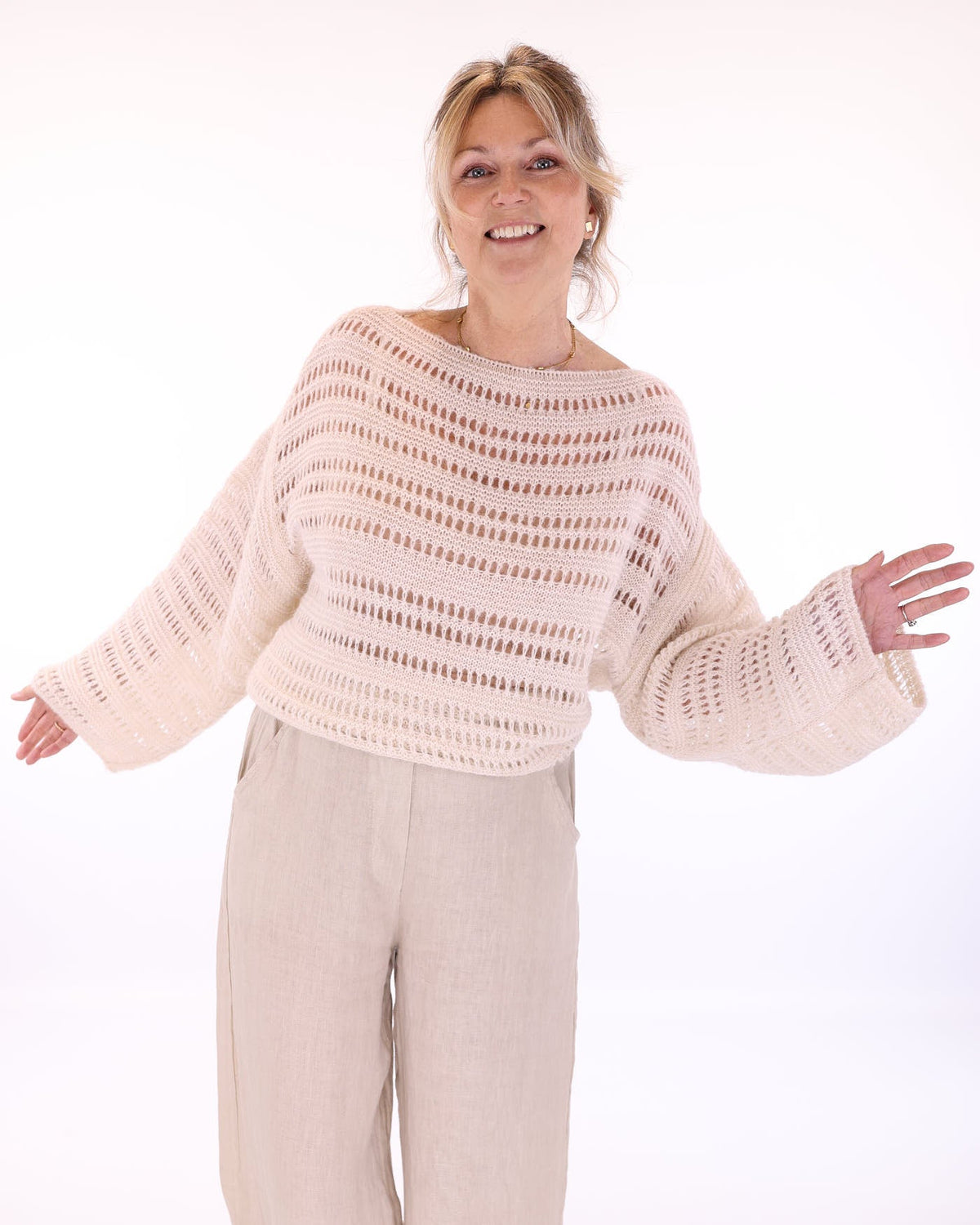 Women's alpaca blend cream crochet style long sleeve jumper on a white background, made in Italy