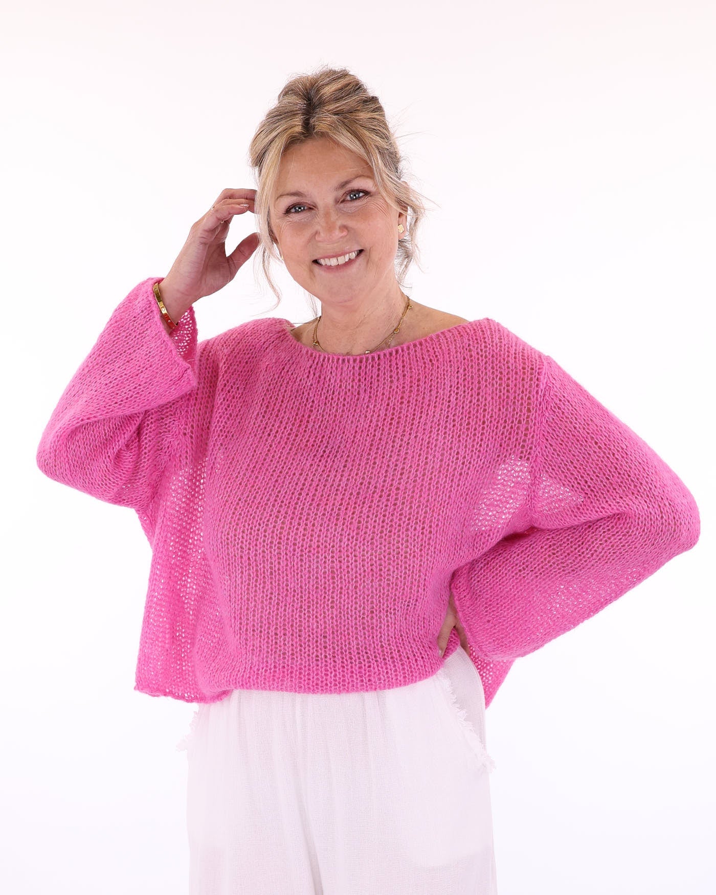 Women's long sleeve cobweb knitted alpaca blend sweater in fuchsia pink, made in Italy
