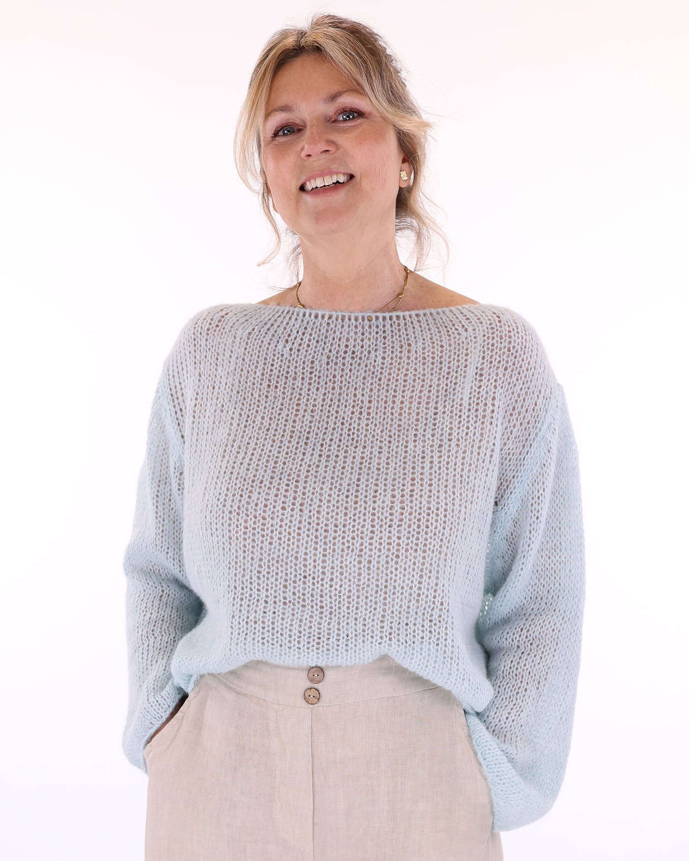 Women's long sleeve cobweb knitted alpaca blend sweater in pale blue, made in Italy