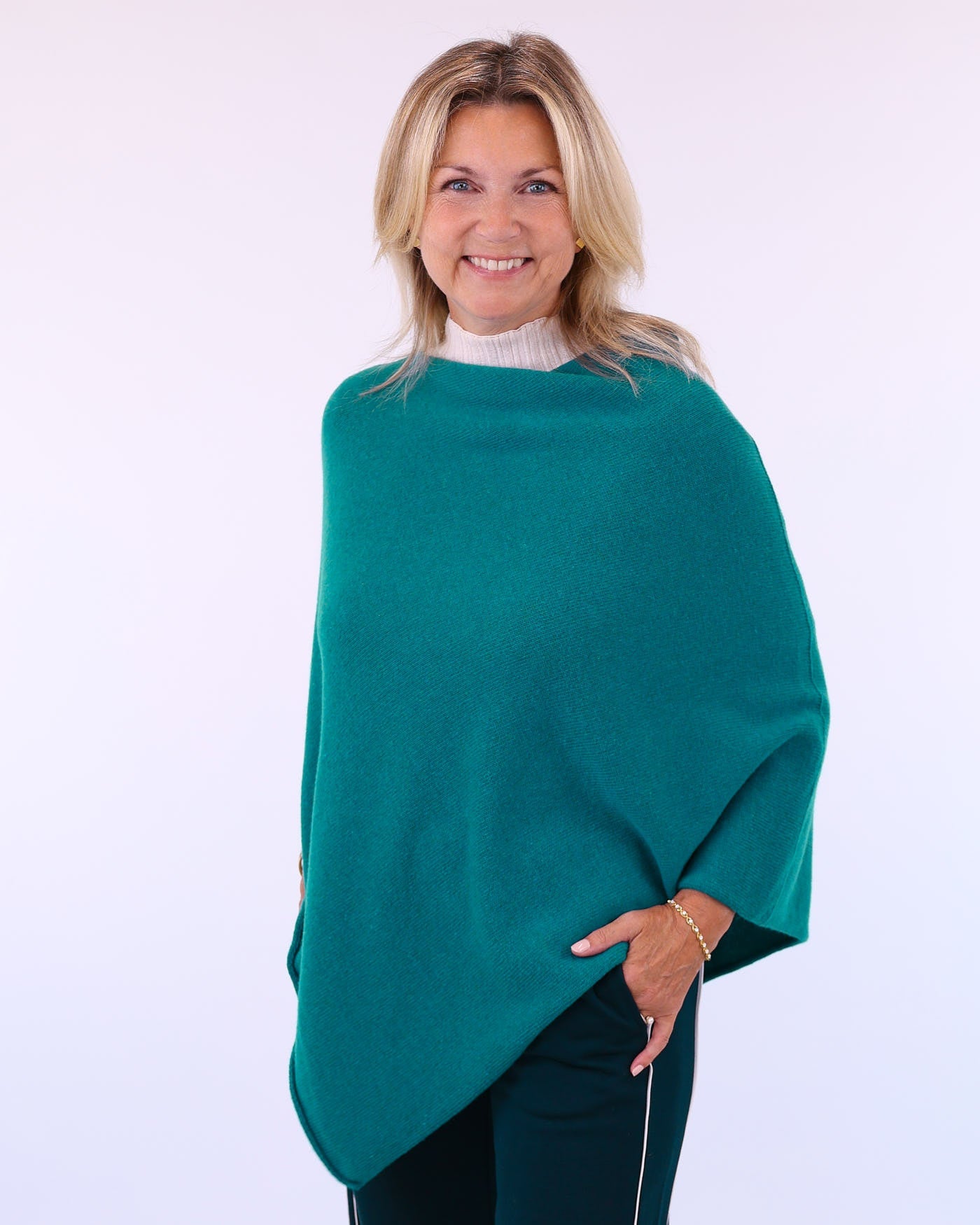 Women's cashmere blend poncho in teal green, made in Italy