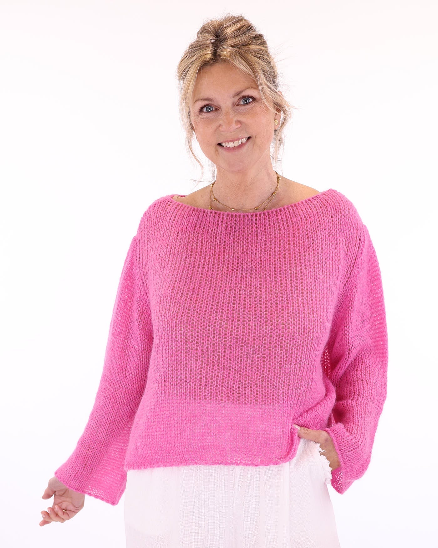Women's long sleeve cobweb knitted alpaca blend sweater in fuchsia pink, made in Italy